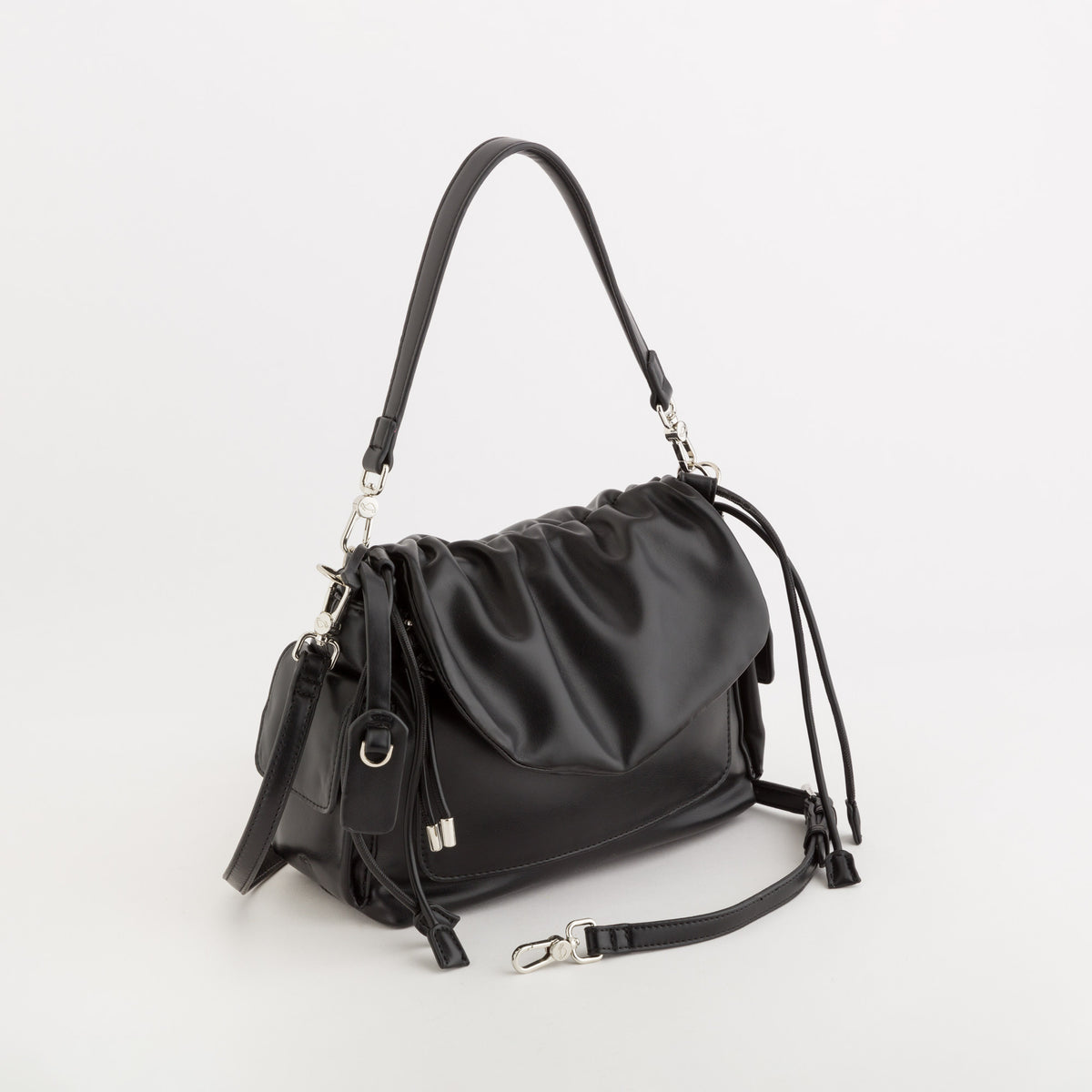 A black leather shoulder bag with a slouchy, gathered silhouette, featuring a top handle, a detachable shoulder strap, and silver-tone hardware, photographed on a clean white background.
